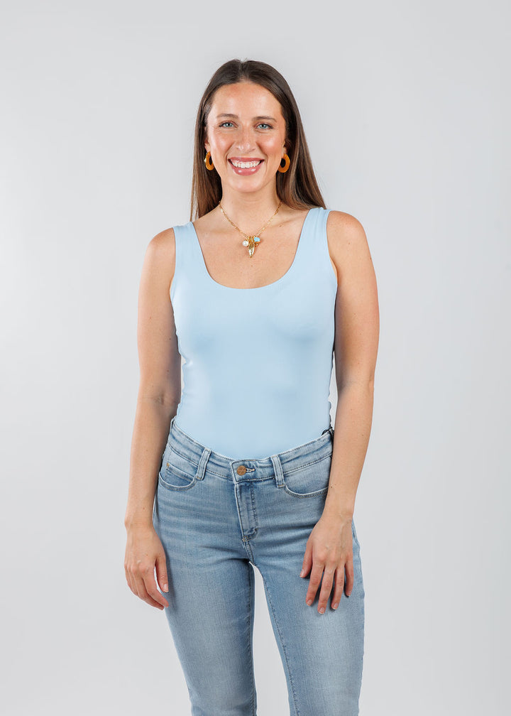 A'NUE The Classic Micro Tank Top in Powder featuring a scoop neckline, wide shoulder straps, form-fitting fit, travel-friendly style available at Barbara Katz.