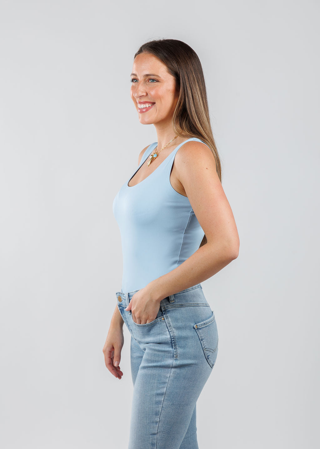 A'NUE The Classic Micro Tank Top in Powder featuring a scoop neckline, wide shoulder straps, form-fitting fit, travel-friendly style available at Barbara Katz.