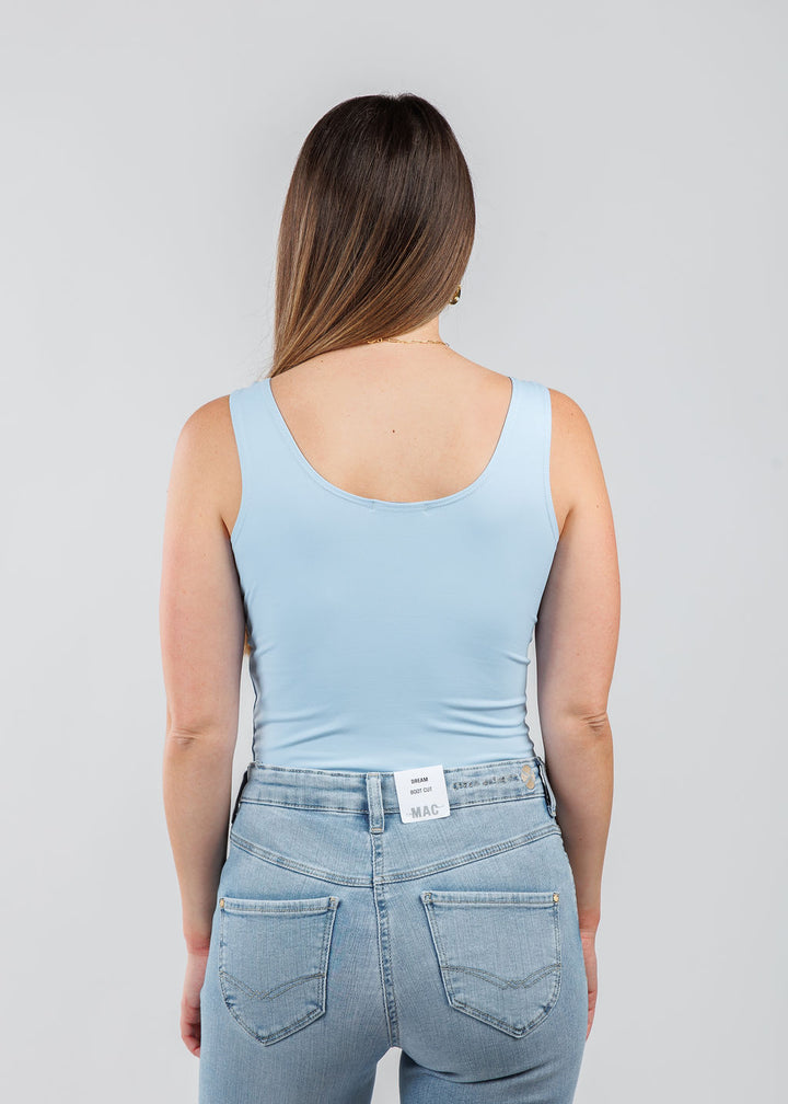 A'NUE The Classic Micro Tank Top in Powder featuring a scoop neckline, wide shoulder straps, form-fitting fit, travel-friendly style available at Barbara Katz.