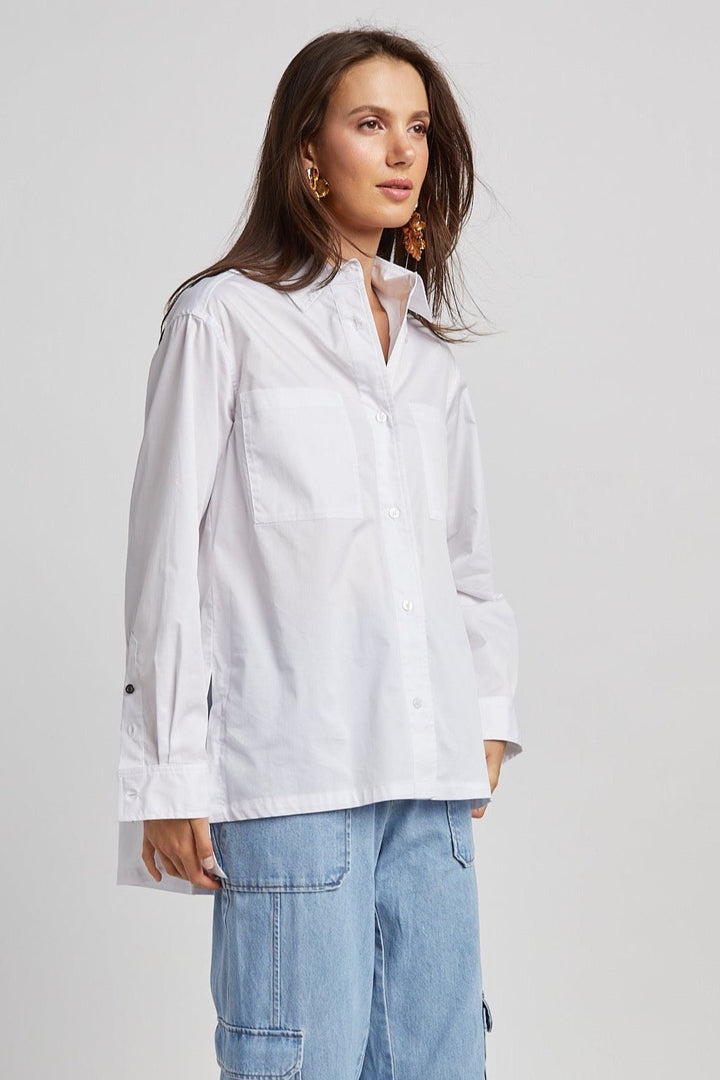 Adroit Atelier Nubia Button Down Stretch Shirt With High Low Hem in White available at Barbara Katz