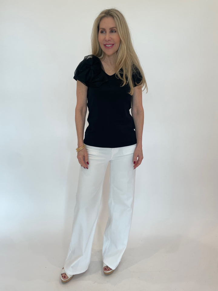 Bariloche Inca Flower Top in Black paired with Frame Le Slim Palazzo Jeans in White available at Barbara Katz