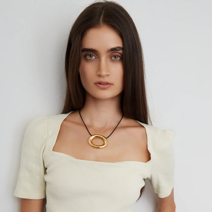 Ben Amun Adobe Cord Necklace with Gold Circular Pendant available at Barbara Katz