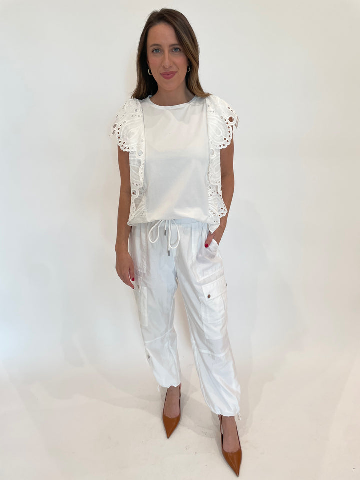 Leo & Ugo Abigail Eyelet Top in White paired with Cinq a Sept Nitsan Parachute Pants in White available at Barbara Katz