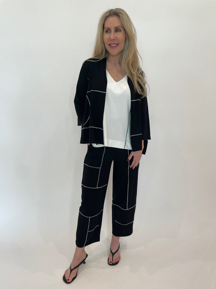 Ozai N Ku Arline Stitch Cardigan in Black with Contrast Stitch V-Neck Top underneath, paired with matching Contrast Stitch Crop Pants in Black available at Barbara Katz