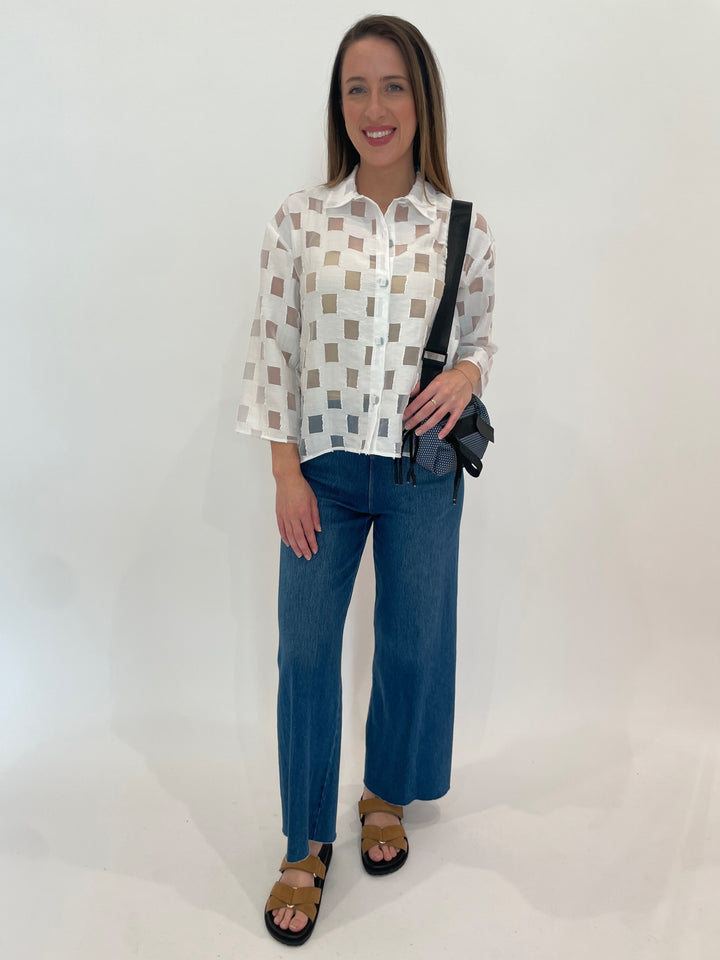 LIV by Habitat Alina Outside The Box 3/4 Sleeve Tunic in White paired with Lysse Erin Hi Waist Wide Leg Denim Pants in Mid Wash, Daniella Lehavi Bonnie Mini Crossbody Bag in Arctic Blue available at Barbara Katz