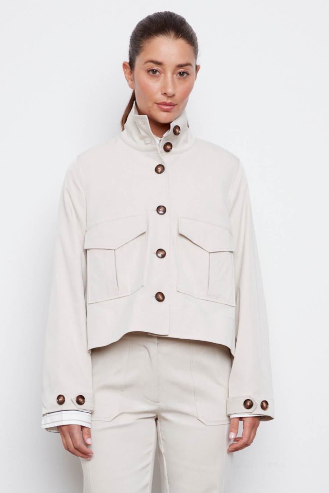 Adroit Atelier Celine Button-Front Jacket With a Slightly High-Low Hem in Elephant available at Barbara Katz