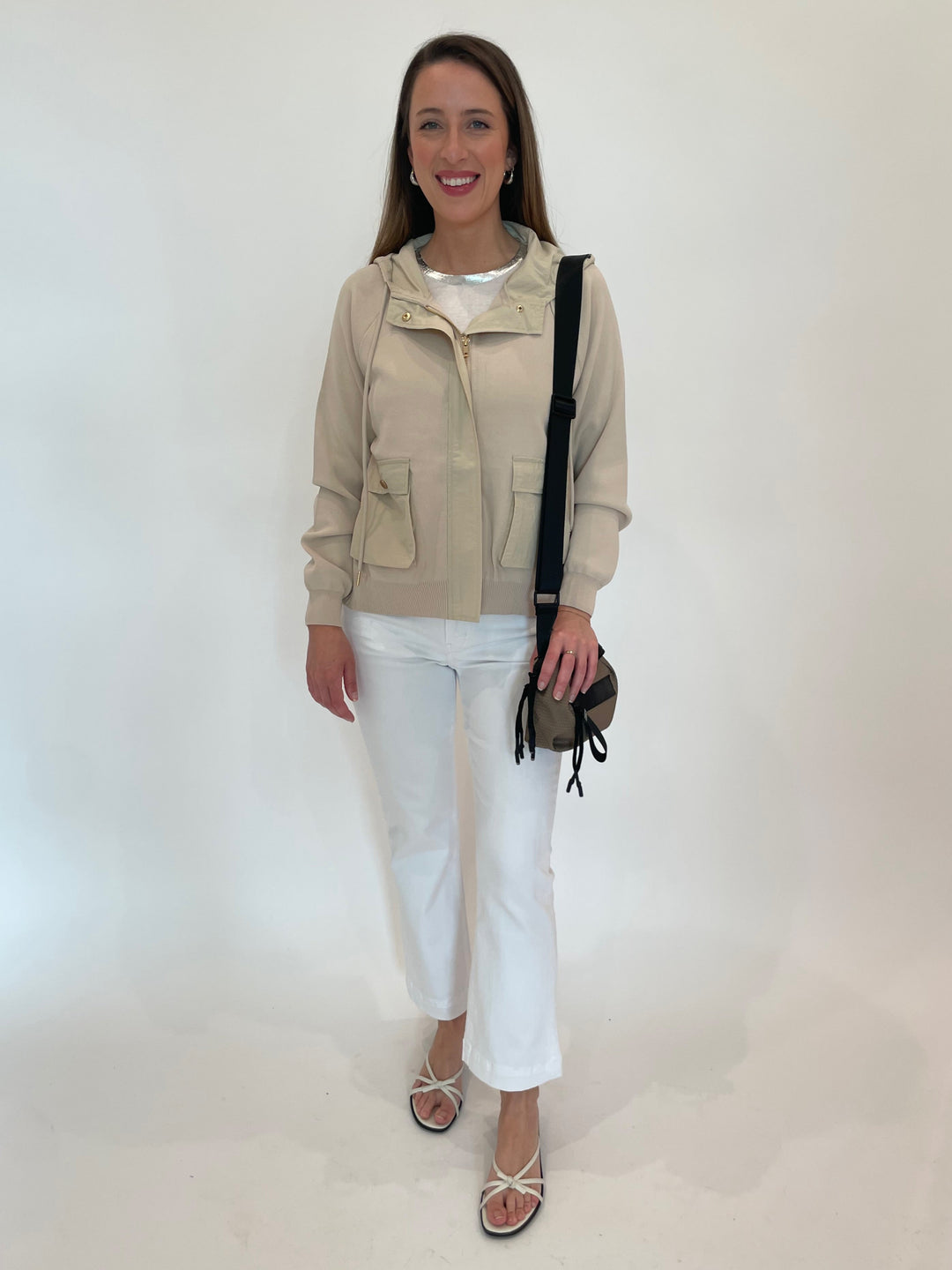 Elliott Lauren Living Proof Zip Front Jacket in Khaki paired with Elliott Lauren 5-Pocket Baby Boot Crop Jeans in White, Daniella Lehavi Bonnie Mini Crossbody Bag in Taupe available at Barbara Katz