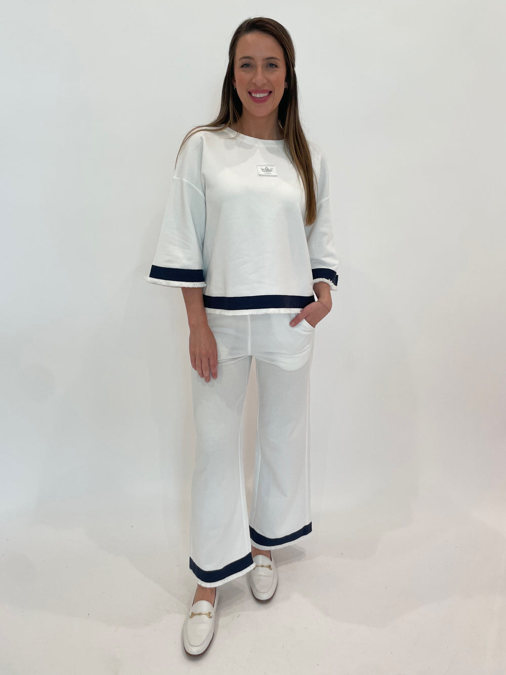 Margittes Fray Drop Shoulder Sweatshirt in Cream paired with matching Margittes Fray Sweatpants in Cream available at Barbara Katz