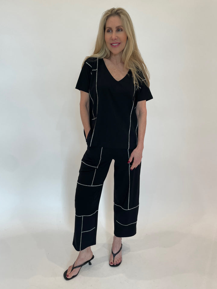 Ozai N Ku Contrast Stitch V-Neck Top With Pocket in Black paired with matching Contrast Stitch Crop Pants in Black available at Barbara Katz
