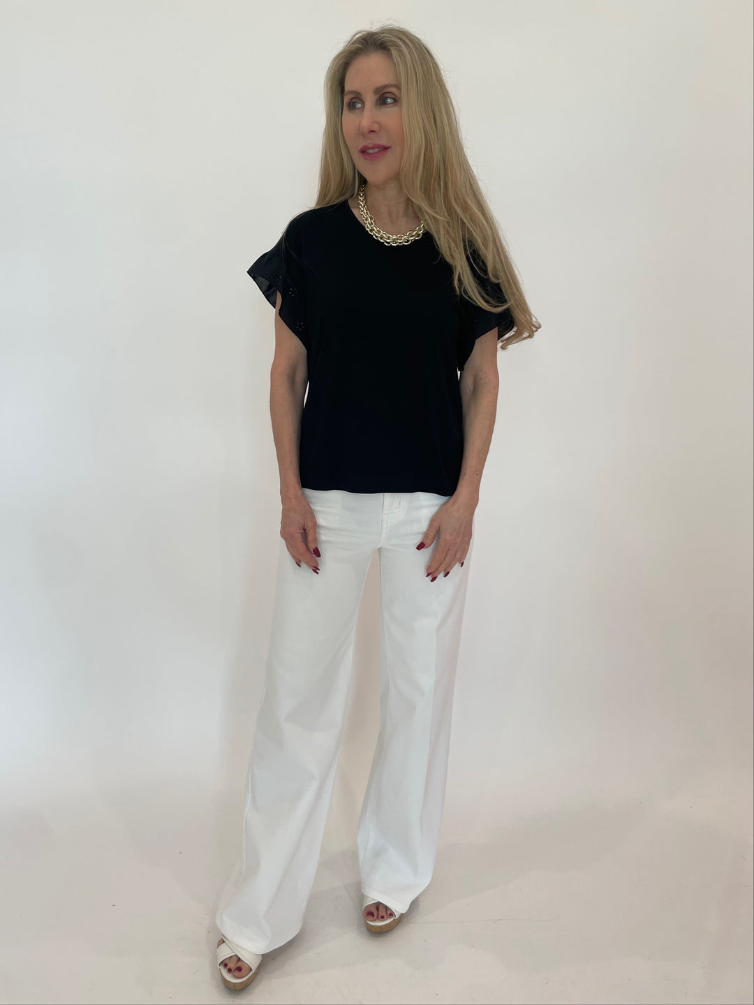 Bariloche Alexandrina Rose Top in Black  paired with Frame Le Slim Palazzo Jeans in White available at Barbara Katz