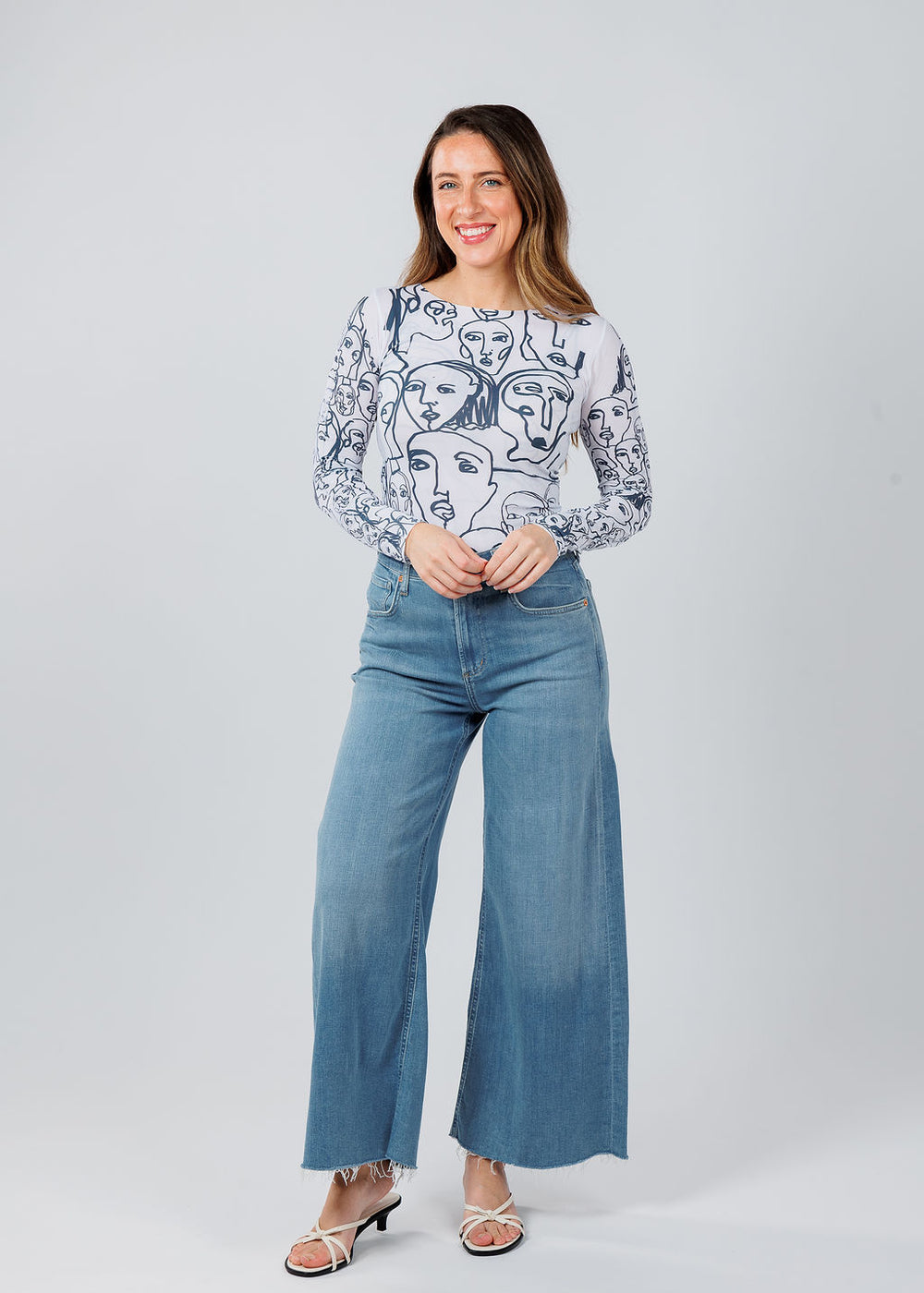 AMB Designs Lines Faces Raw Edge Second Skin Top in White paired with Citizens of Humanity Lyra Crop Wide Leg Jeans in Bhodi available at Barbara Katz