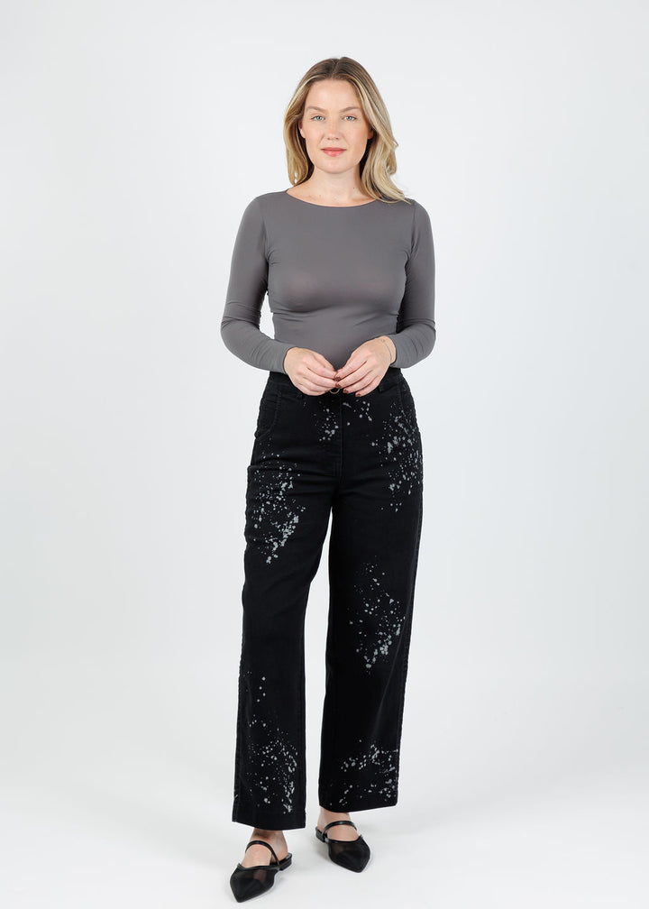 AMB Solid Raw Edge High Neck Second Skin Top in Black Pearl paired with Ozai N Ku Nubia Splash Denim Jeans  in Black/White available at Barbara Katz