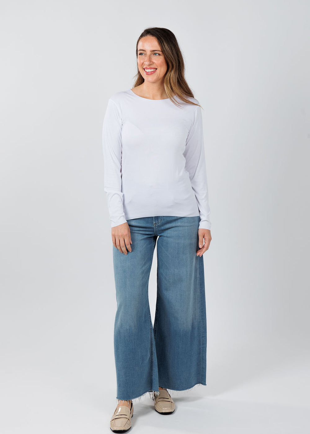 AMB Designs Julia Long Sleeve Top in White paired with Citizens of Humanity Lyra Crop Wide Leg Jeans in Bhodi available at Barbara Katz