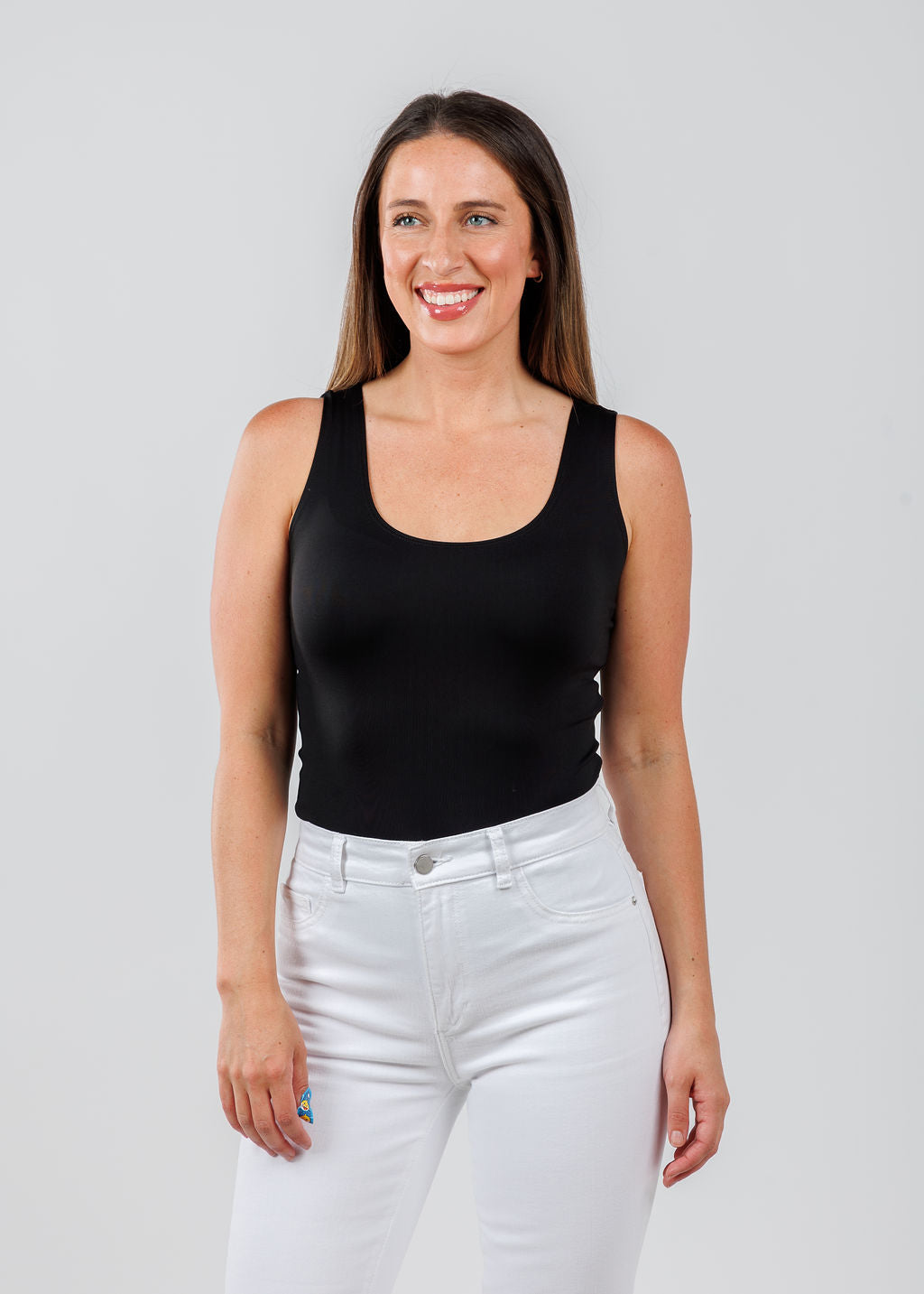 A'NUE The Classic Micro Tank Top in Black featuring a scoop neckline, wide shoulder straps, form-fitting fit, travel-friendly style available at Barbara Katz.
