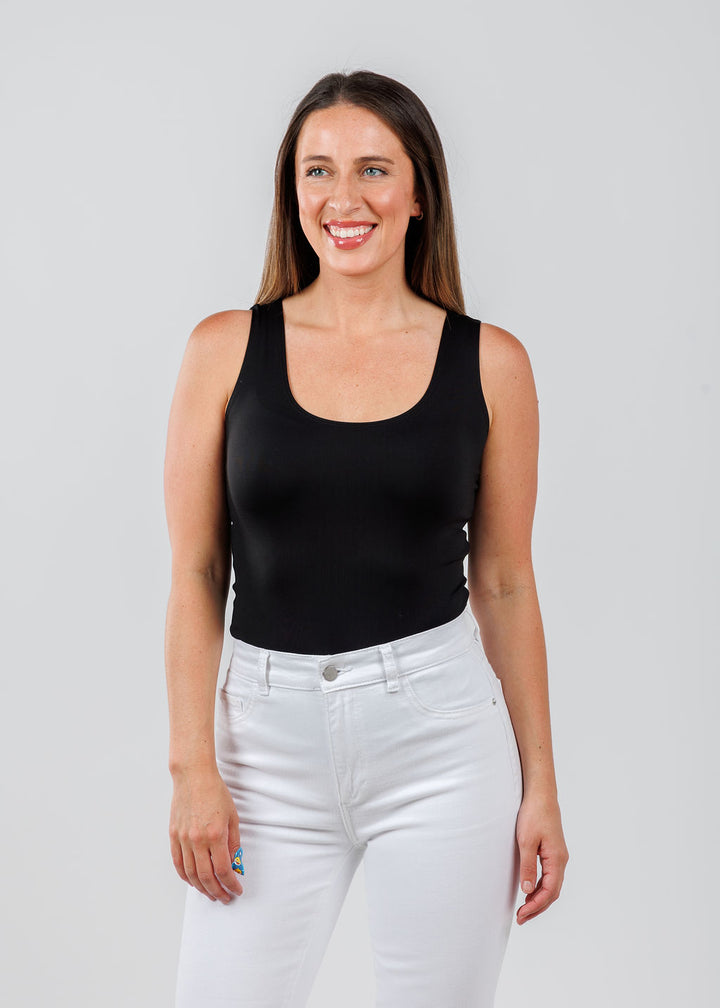 A'NUE The Classic Micro Tank Top in Black featuring a scoop neckline, wide shoulder straps, form-fitting fit, travel-friendly style available at Barbara Katz.