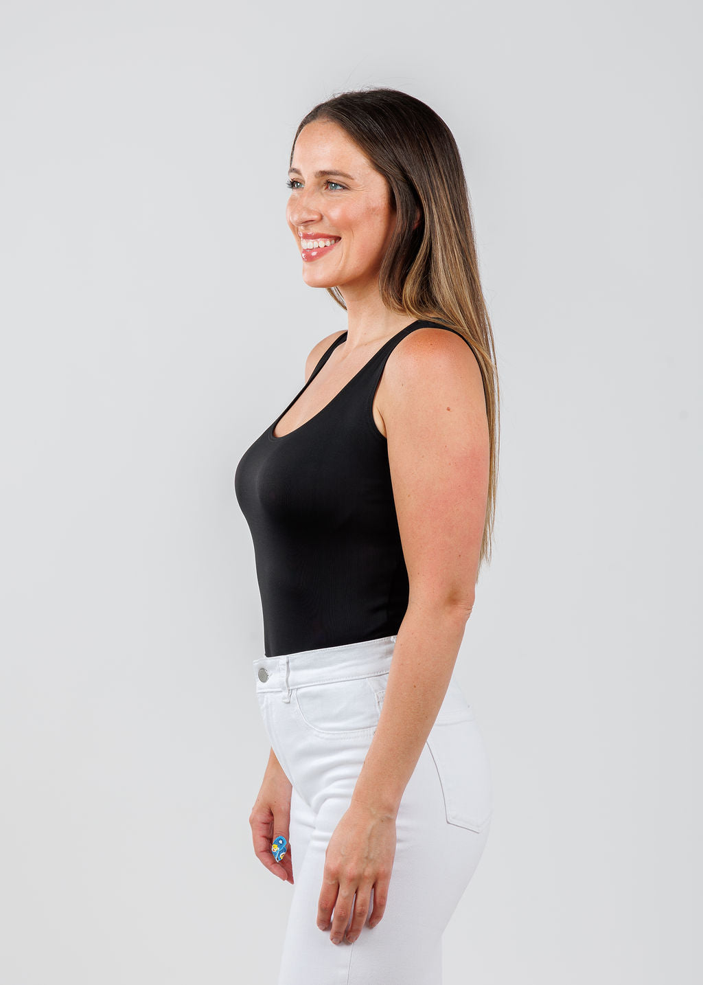 A'NUE The Classic Micro Tank Top in Black featuring a scoop neckline, wide shoulder straps, form-fitting fit, travel-friendly style available at Barbara Katz.