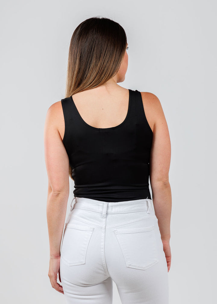 A'NUE The Classic Micro Tank Top in Black featuring a scoop neckline, wide shoulder straps, form-fitting fit, travel-friendly style available at Barbara Katz.