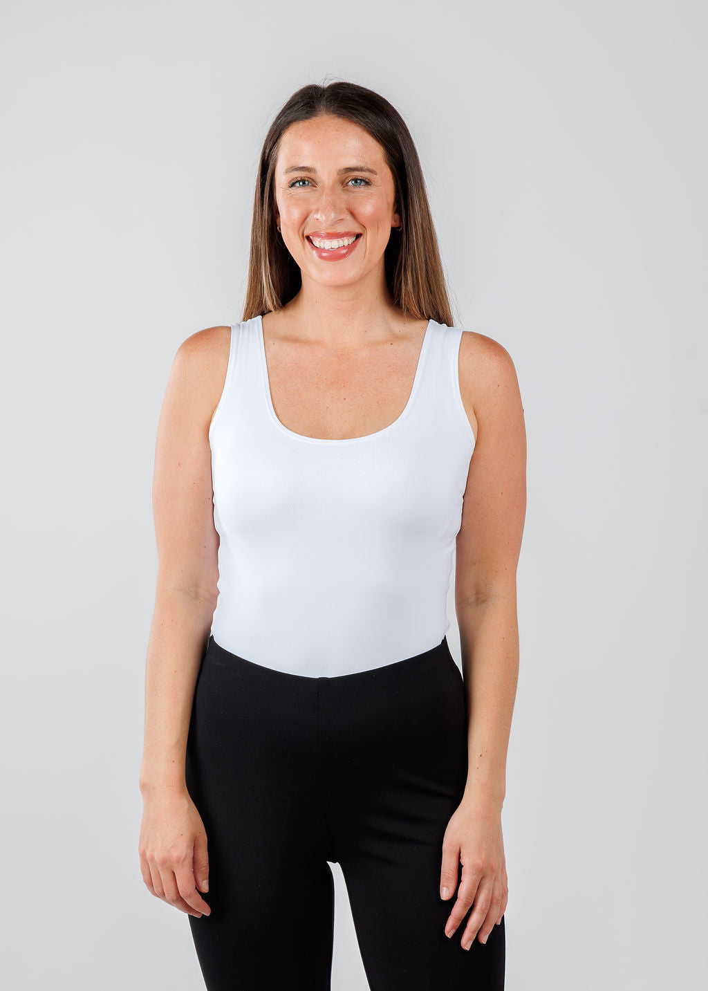 A'NUE The Classic Micro Tank Top in White featuring a scoop neckline, wide shoulder straps, form-fitting fit, travel-friendly style available at Barbara Katz.