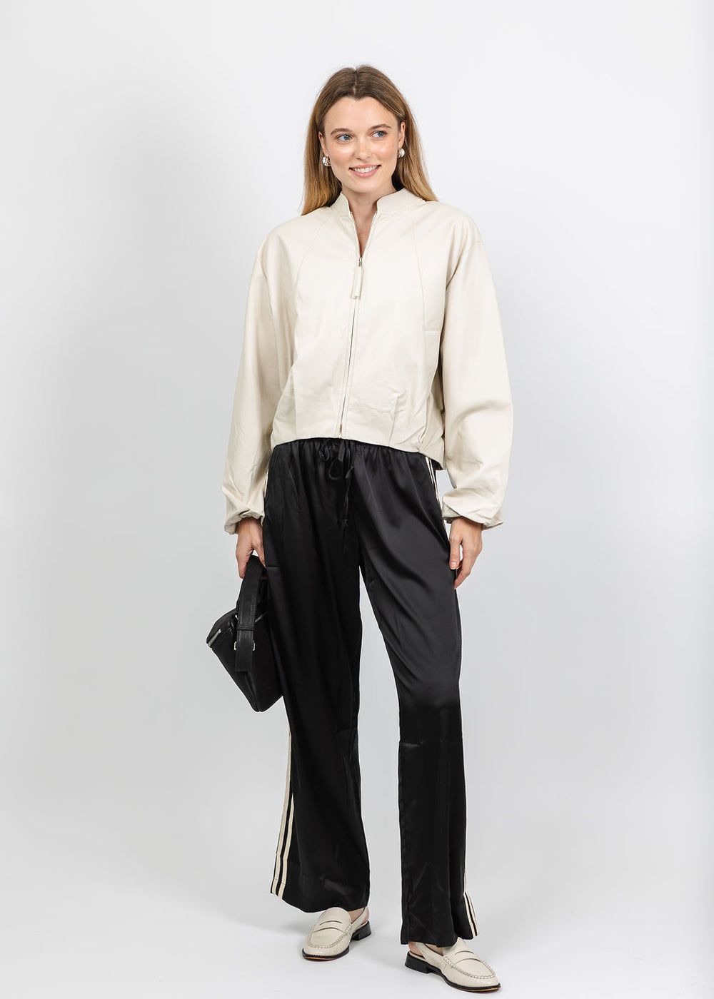 BK Boja Vegan Leather Blouson Jacket in Birch paired with BK Vida Track Pant in Black Cream available at Barbara Katz