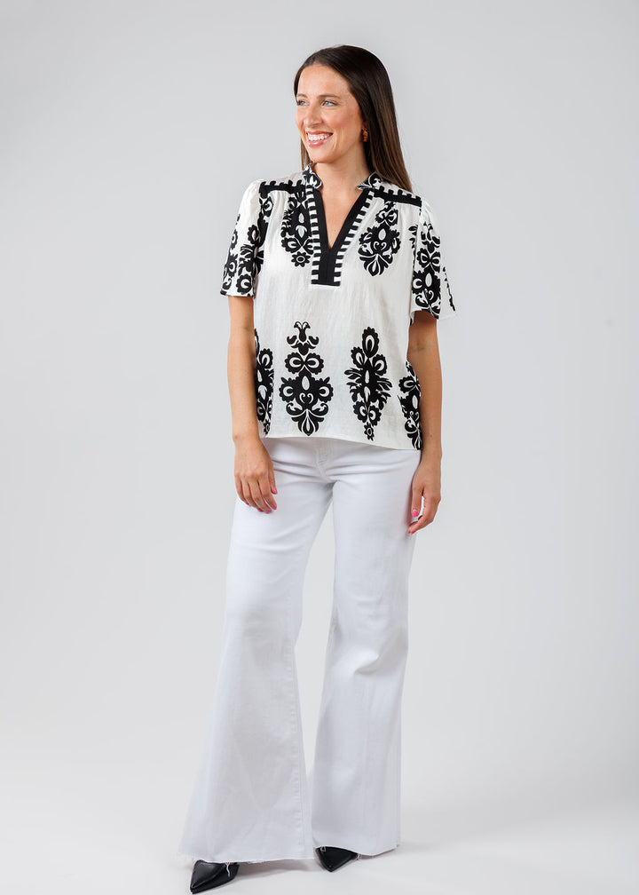 BK Embroidered Split Neck Top in White/Black paired with Pistola Denim Izzy Wide Leg Crop Jeans in Vivid White available at Barbara Katz