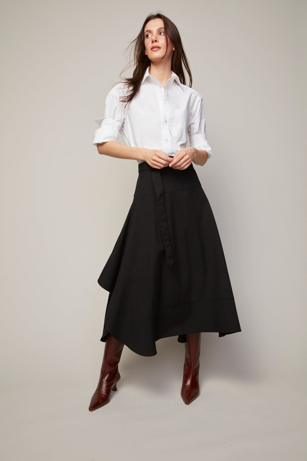 Adroit Atelier Benika Long Asymmetric Flair Skirt in Black available at Barbara Katz