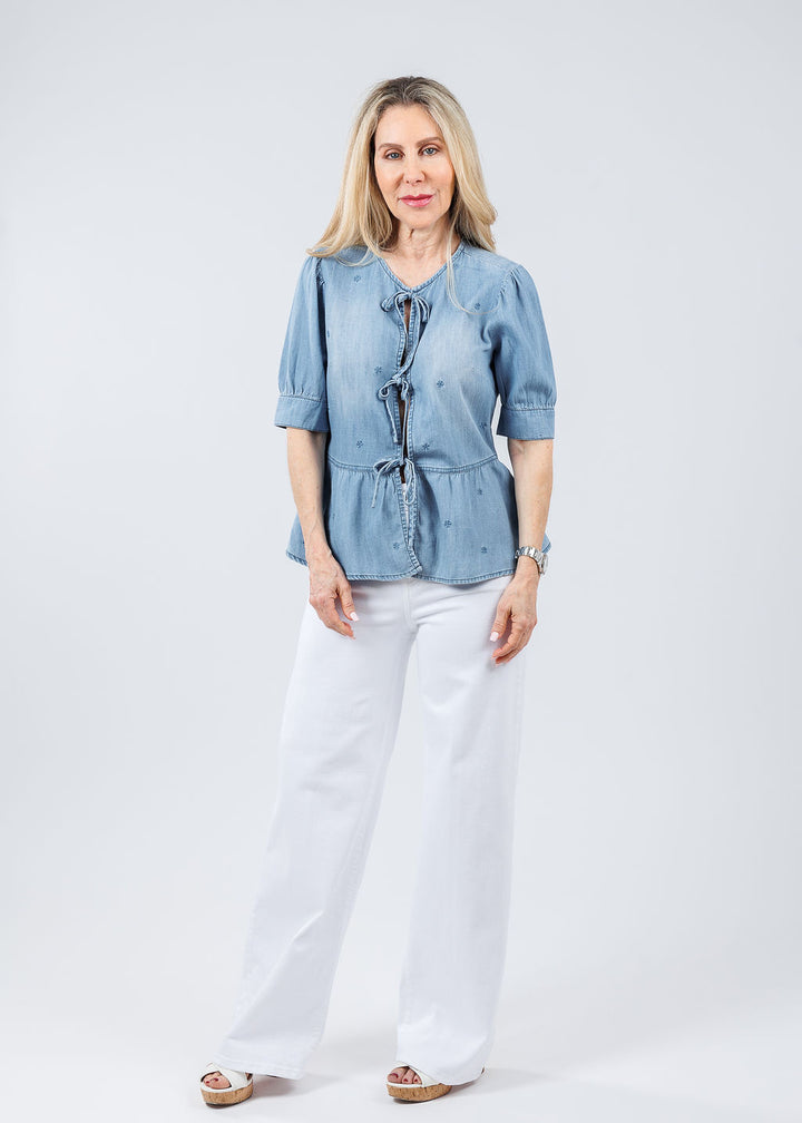 BK Angela Embroidered Floral Bow Top in Denim paired with Frame Le Slim Palazzo Jeans in White available at Barbara Katz