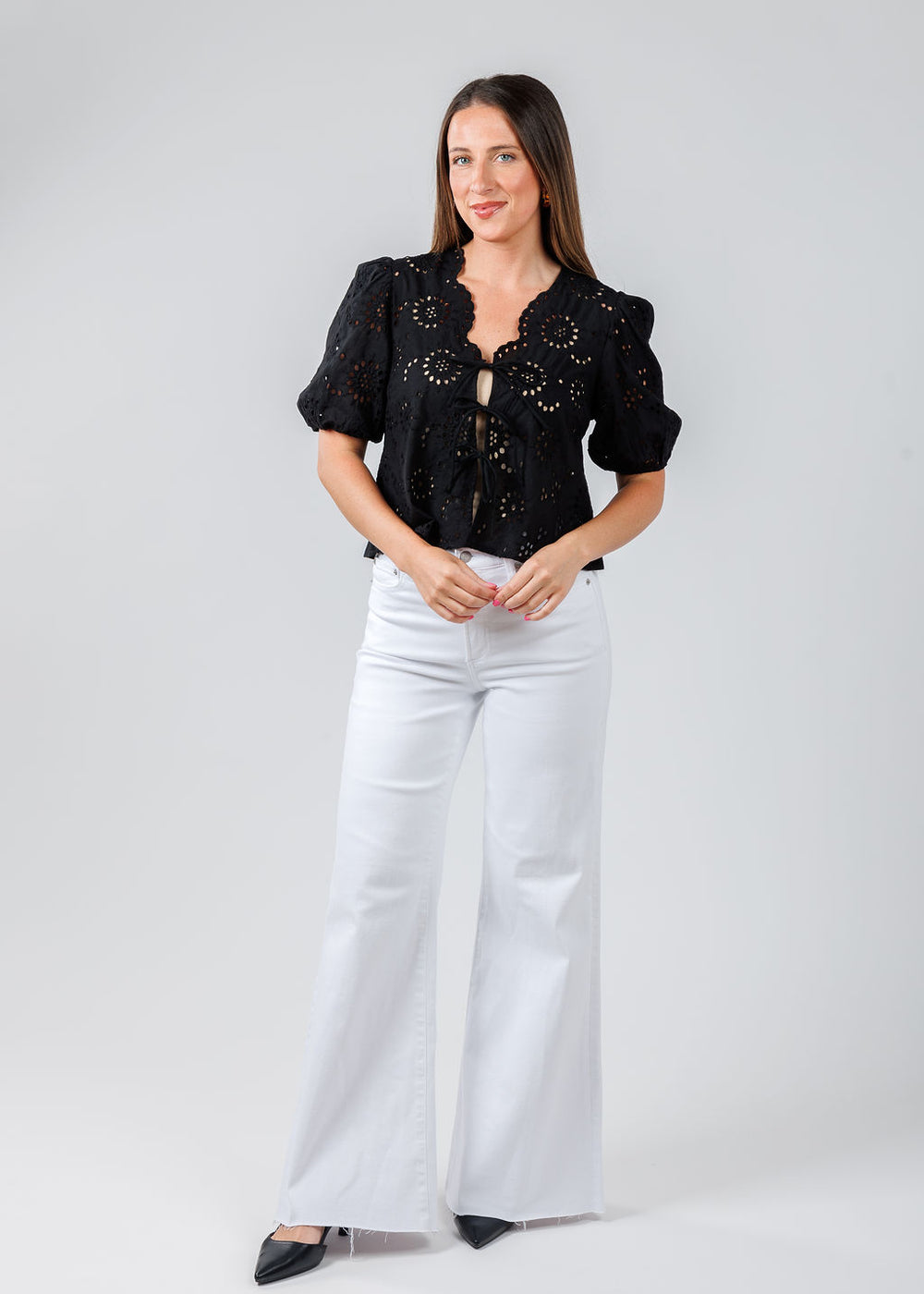 BK Roxana Top in Black paired with Pistola Denim Izzy Mid Rise Wide Leg Crop Jeans in Vivid White available at Barbara Katz