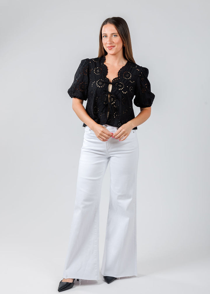 BK Roxana Top in Black paired with Pistola Denim Izzy Mid Rise Wide Leg Crop Jeans in Vivid White available at Barbara Katz