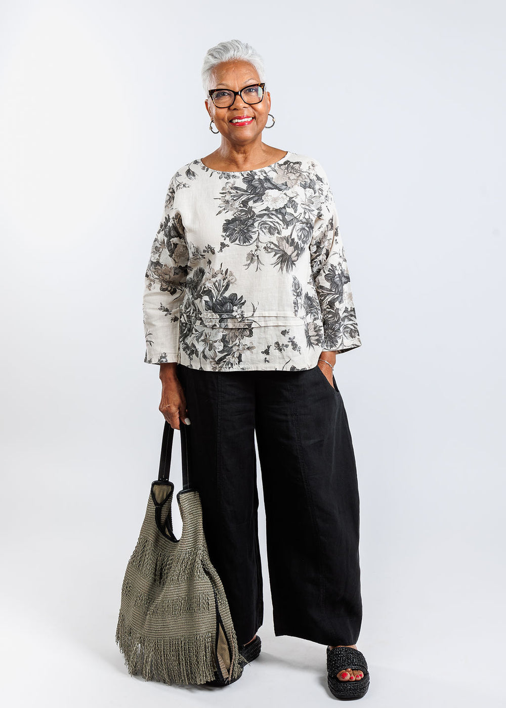 BK Floral Linen 3/4 Sleeve Top in Coconut Blooms paired with Banana Blue Charlotte Pants in Black, Anita Bilardi Picasso Raffia Handbag in Olive Green available at Barbara Katz