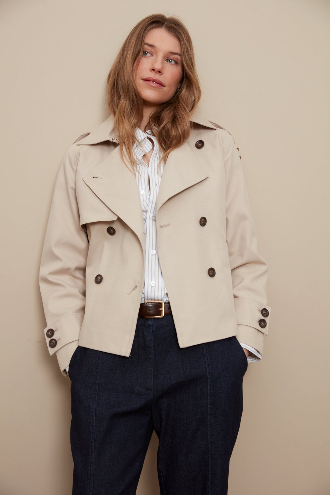 Adroit Atelier Calista Short Double Breasted Trench Coat in Sand available at Barbara Katz