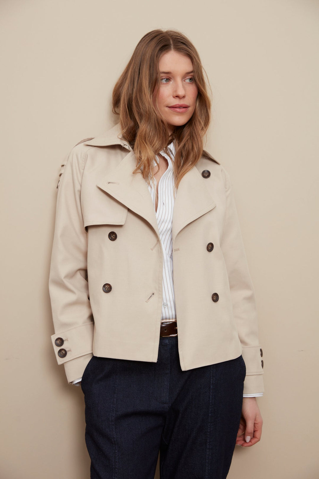 Adroit Atelier Calista Short Double Breasted Trench Coat in Sand available at Barbara Katz