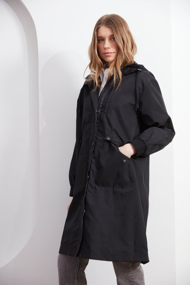 Adroit Atelier Chelsea The City Hooded Raincoat in Black available at Barbara Katz