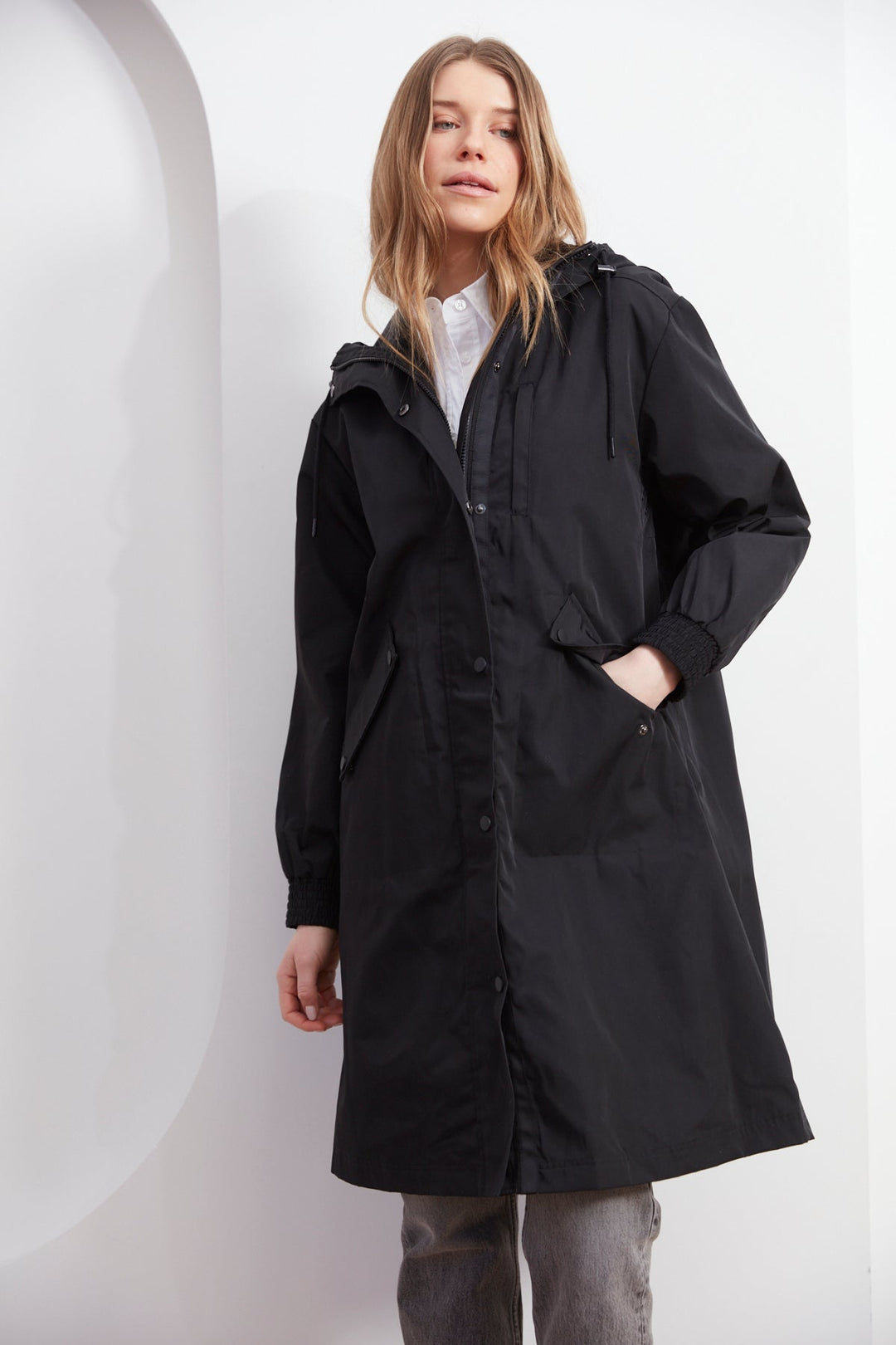 Adroit Atelier Chelsea The City Hooded Raincoat in Black available at Barbara Katz