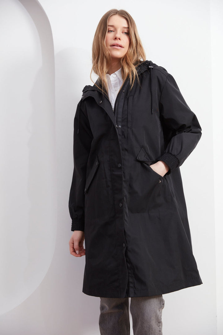 Adroit Atelier Chelsea The City Hooded Raincoat in Black available at Barbara Katz
