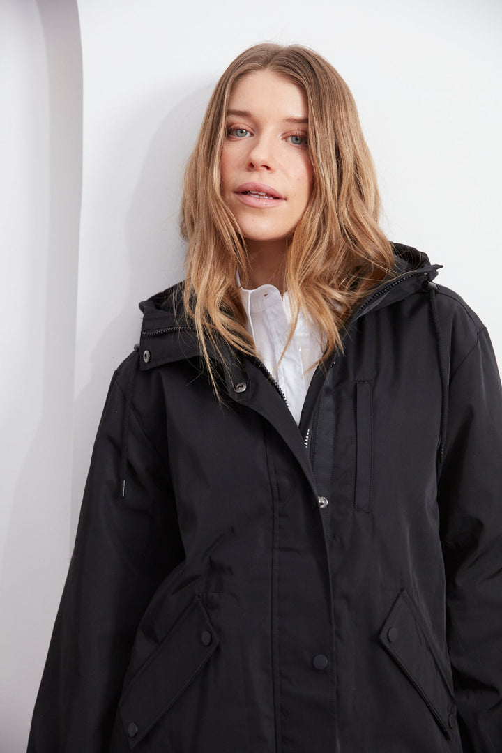 Adroit Atelier Chelsea The City Hooded Raincoat in Black available at Barbara Katz
