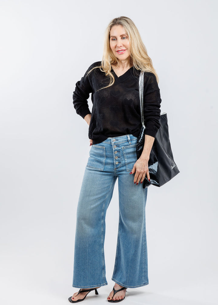 Pure Amici Heart V-Neck Sweater in Black paired with Citizens of Humanity Lyra Patch Pockets in Splendor, Carlos Falchi Vegan Travel Bag in Black available at Barbara Katz