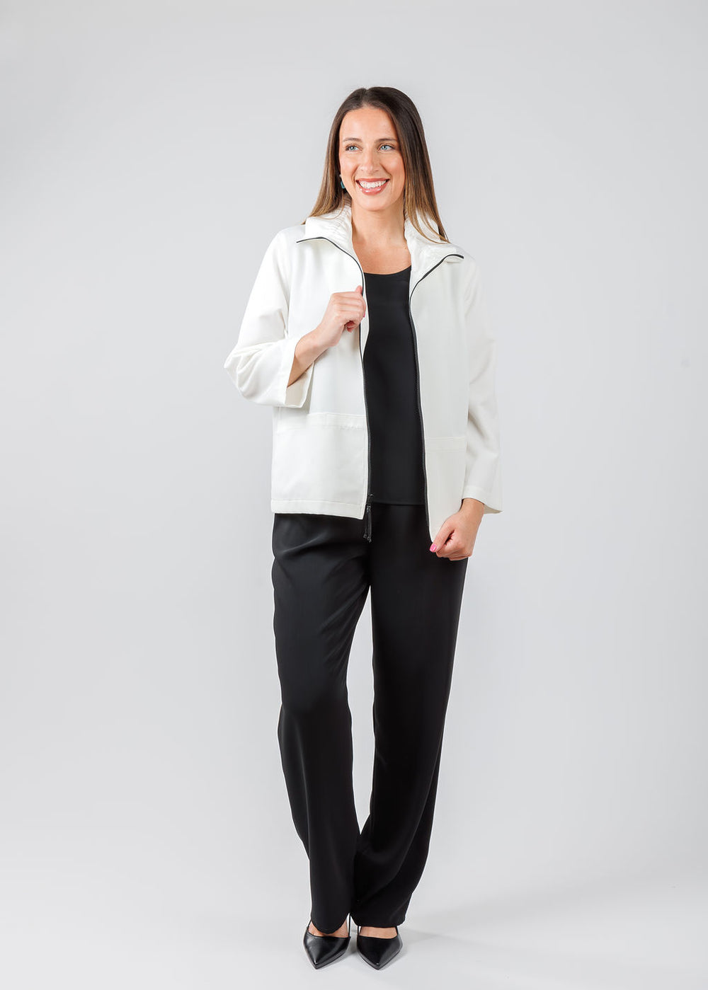 Caroline Rose Comfort Stretch Jacket in White paired with Caroline Rose Matte Crepe Straight Leg Pants in Black available at Barbara Katz