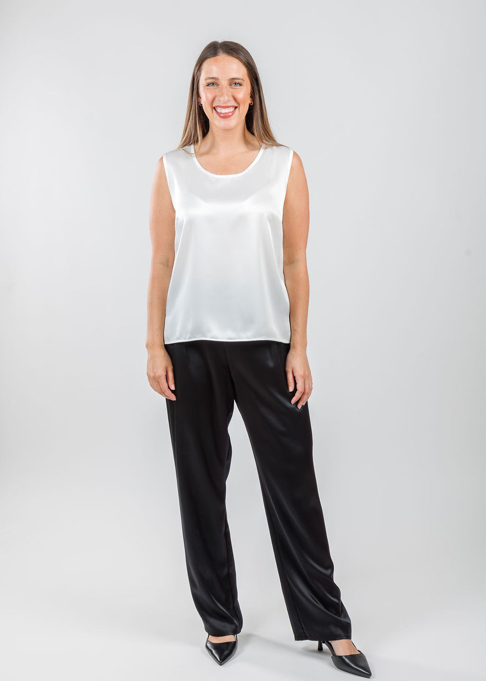 Caroline Rose Soft Satin Tank in White paired with Caroline Rose Soft Satin Pants in Black available at Barbara Katz