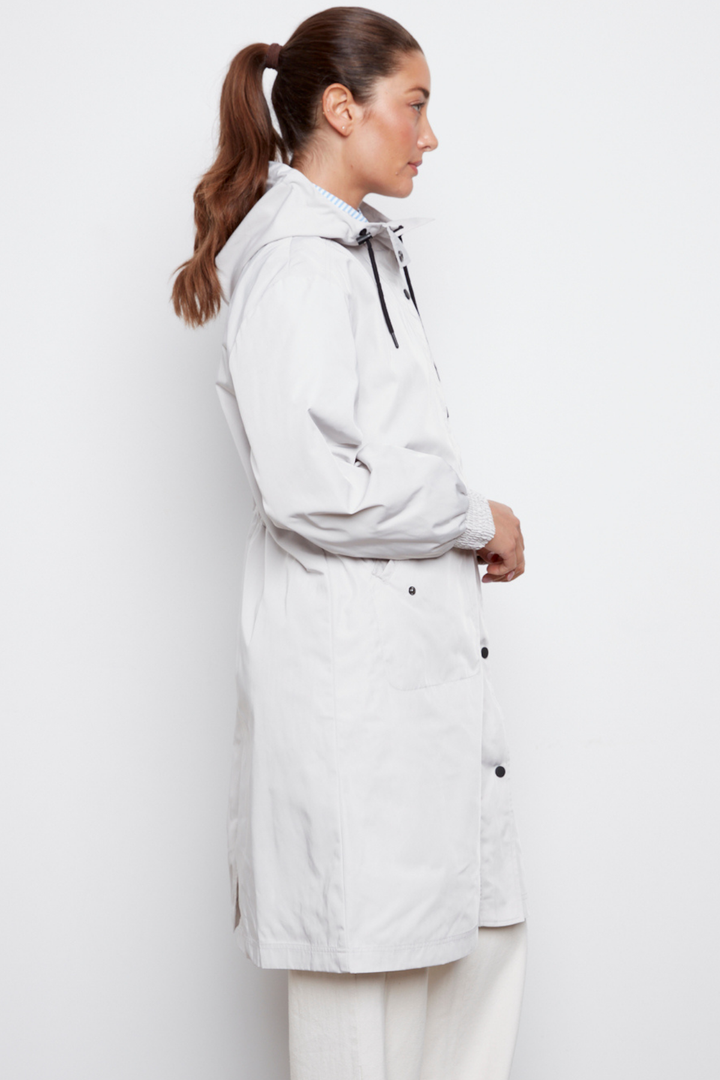 Adroit Atelier Chelsea The City Hooded Raincoat in Light Grey available at Barbara Katz