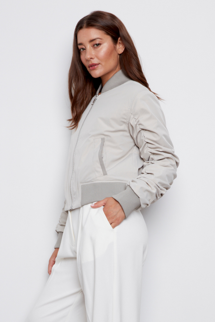 Adroit Atelier Cierra Bomber Jacket With Shirring Detail in Elephant available at Barbara Katz