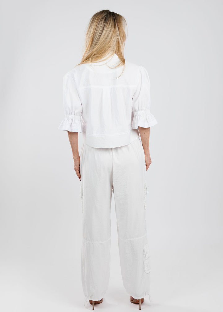 Cinq a Sept Holly Parachute Jacket in White paired with matching Cinq a Sept Nitsan Ruffle Parachute Pants in White available at Barbara Katz