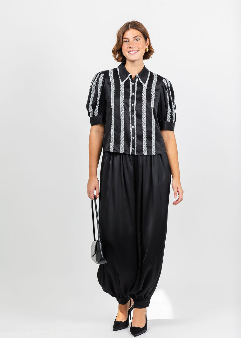 Cinq a Sept Nalea Top in Black/Ivory paired with Cinq a Sept Esme Satin Verne Pant in Black available at Barbara Katz