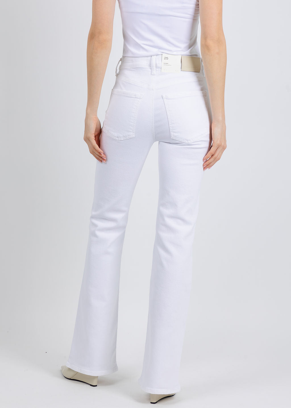Citizens of Humanity Lilah High Rise Bootcut Jeans 32" in Soft White available at Barbara Katz