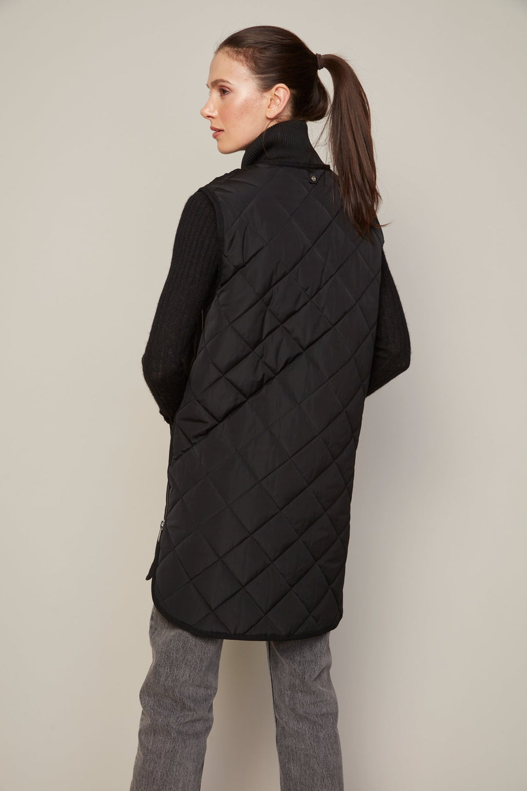 Adroit Atelier Destiny Sleeveless Quilted Vest With Zipper Detail in Black available at Barbara Katz