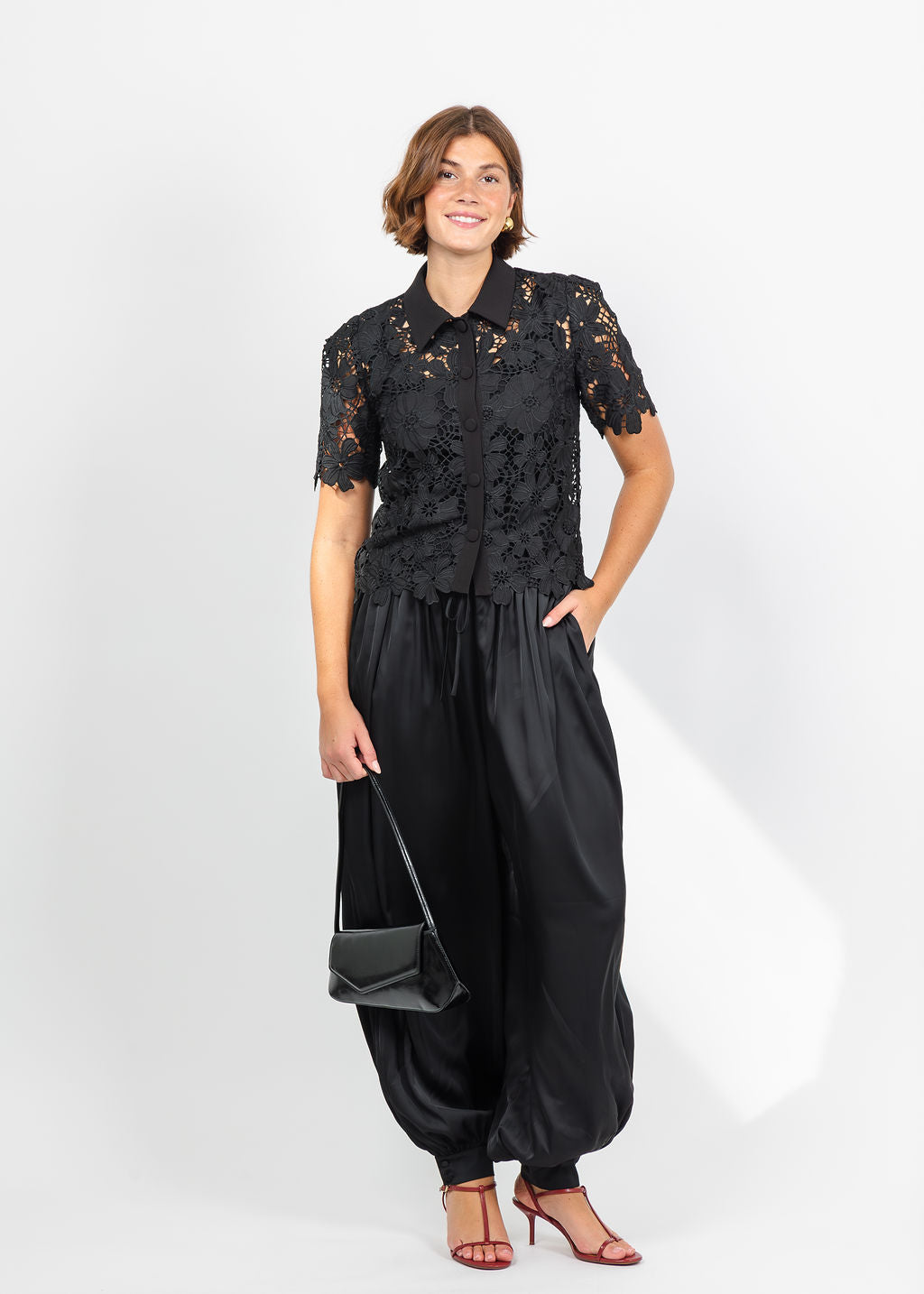 Dani Parker The Dani Lace Top in Black paired with Cinq a Sept Esme Satin Verne Pant in Black available at Barbara Katz