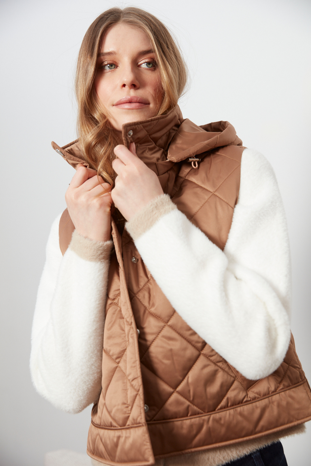 Adroit Atelier Daniela Sleeveless Diamond Quilted Vest With Detachable Hood in Bronze available at Barbara Katz