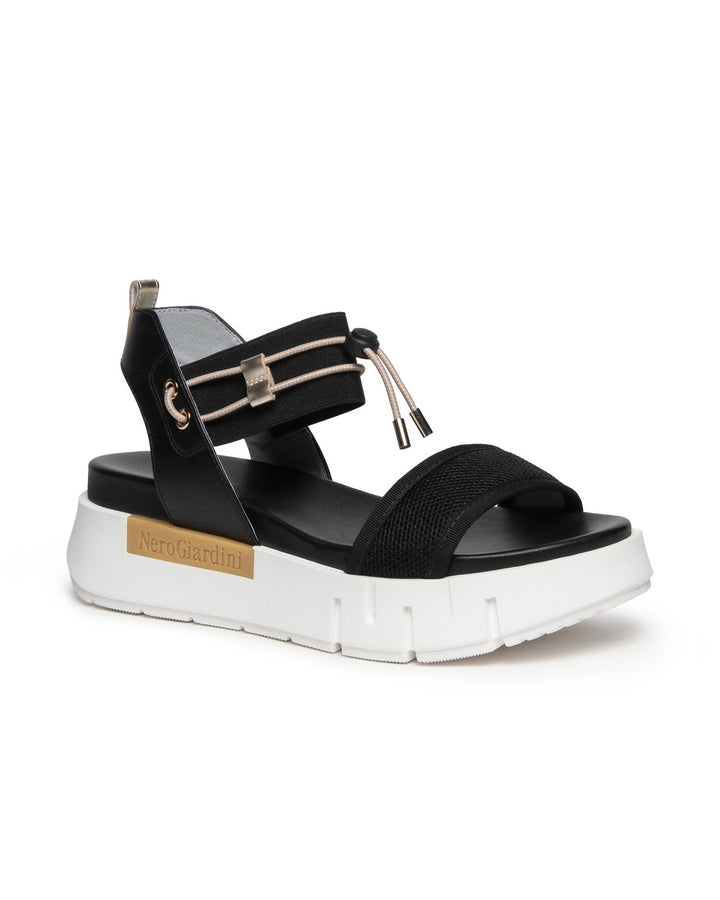 Nero Giardini Bungee Platform Flat Sandal in Black available atBarbara Katz