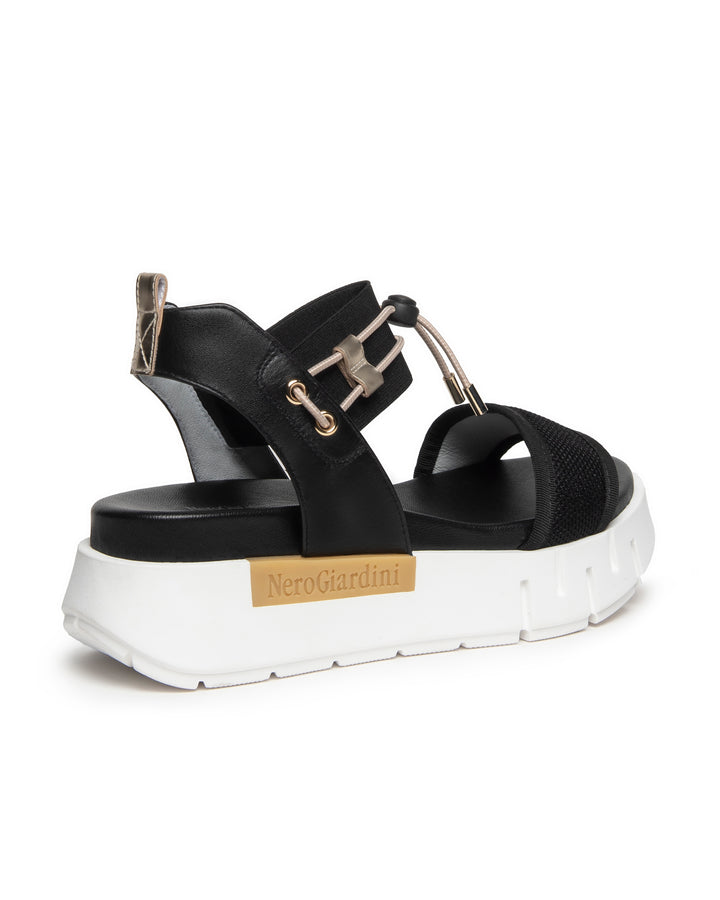 Nero Giardini Bungee Platform Flat Sandal in Black available atBarbara Katz