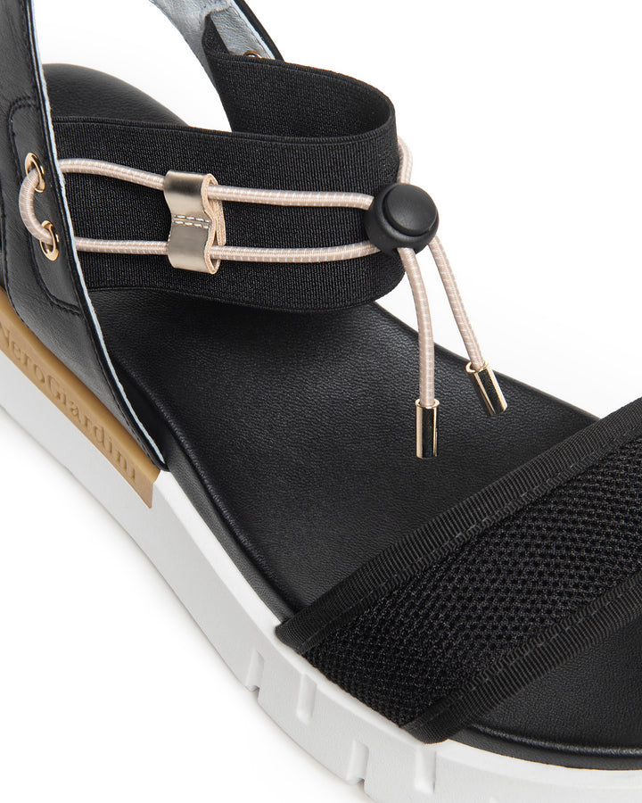 Nero Giardini Bungee Platform Flat Sandal in Black available atBarbara Katz