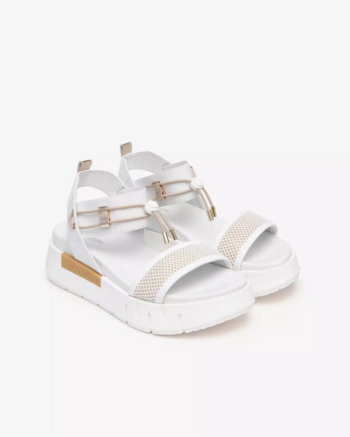 NeroGiardini Chey Bungee Platform Flat Sandal in White available at Barbara Katz